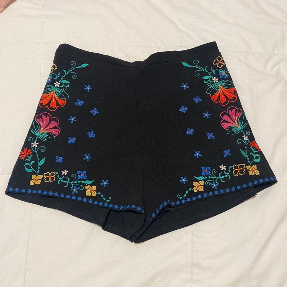 Black shorts with bright floral